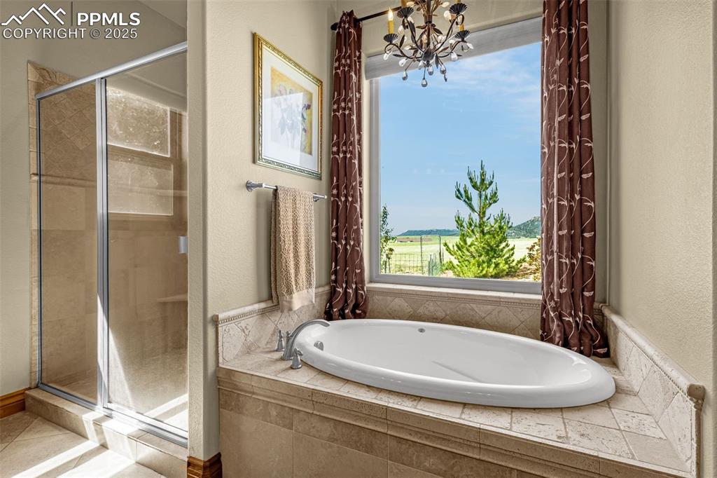 11784 Spruce Mountain Road Larkspur, CO 80118 - Photo 26 of 49 a bathroom with a granite countertop sink and a mirror