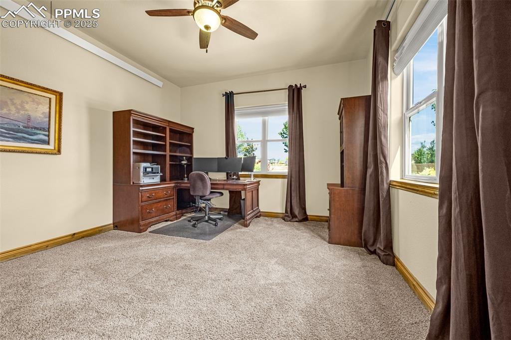 11784 Spruce Mountain Road Larkspur, CO 80118 - Photo 28 of 49 a view of a livingroom with furniture and a window