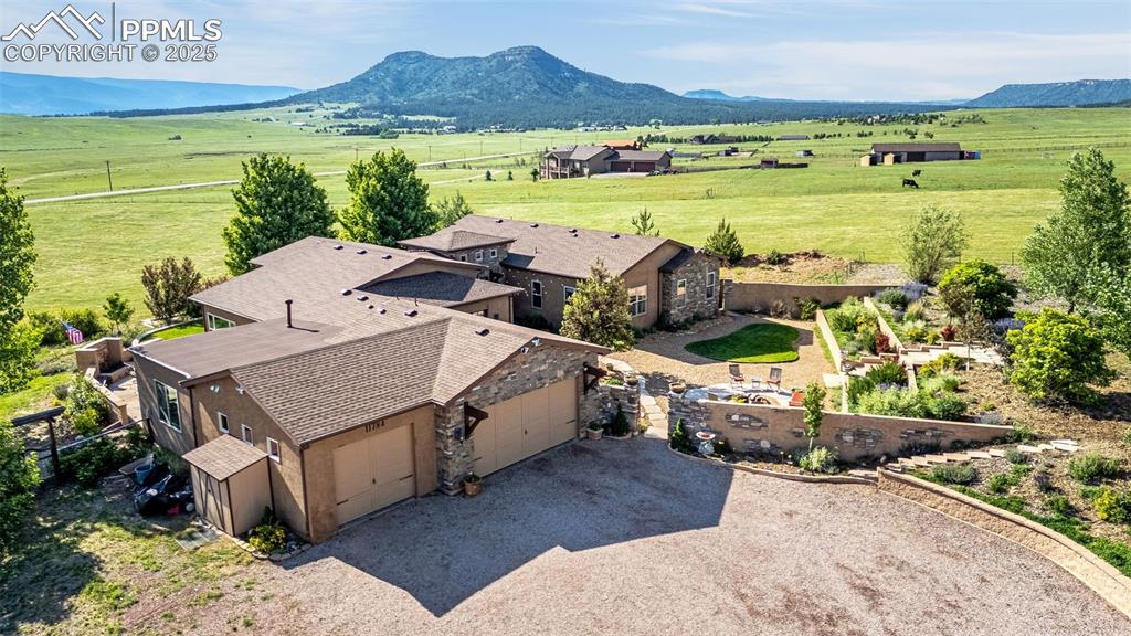 11784 Spruce Mountain Road Larkspur, CO 80118 - Photo 46 of 49 a view of a terrace with a table and chairs