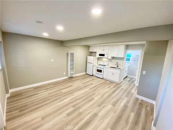 a room with a bed and a walk in closet