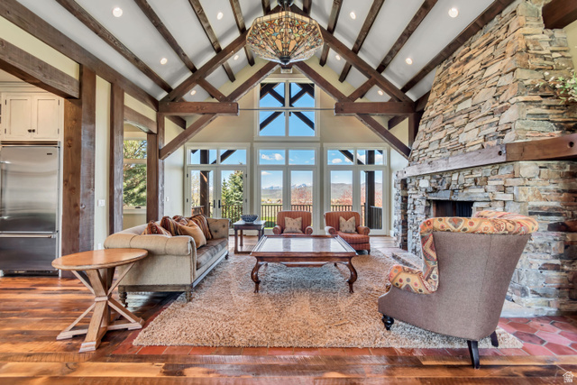 2579 Splendor Valley Road Kamas, UT 84036 - Photo 42 of 87 Living room featuring a stone fireplace, a mountain view, and dark wood-style flooring