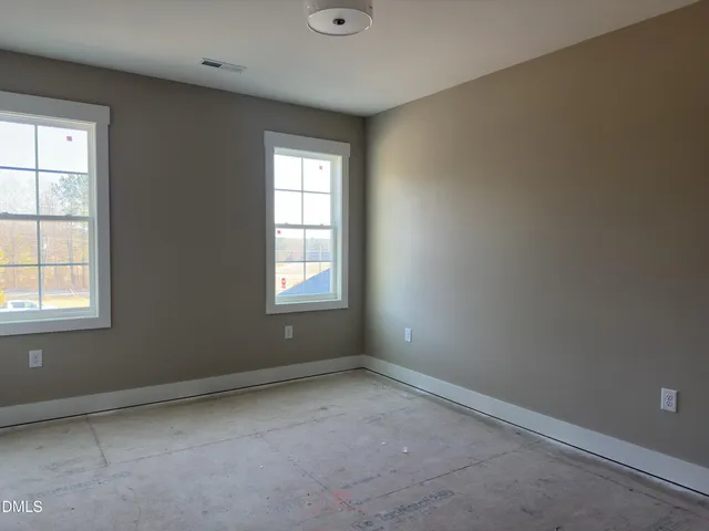 an empty room with windows