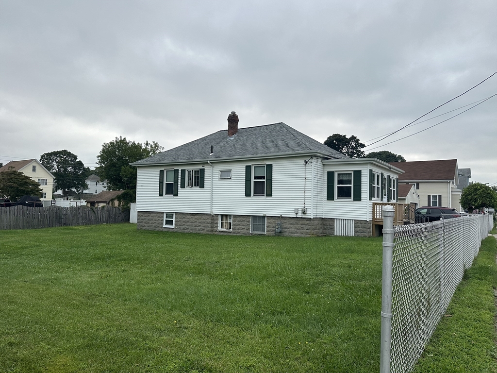 138 Anthony Street Fall River, MA 02721 - Photo 3 of 11 a front view of a house with garden