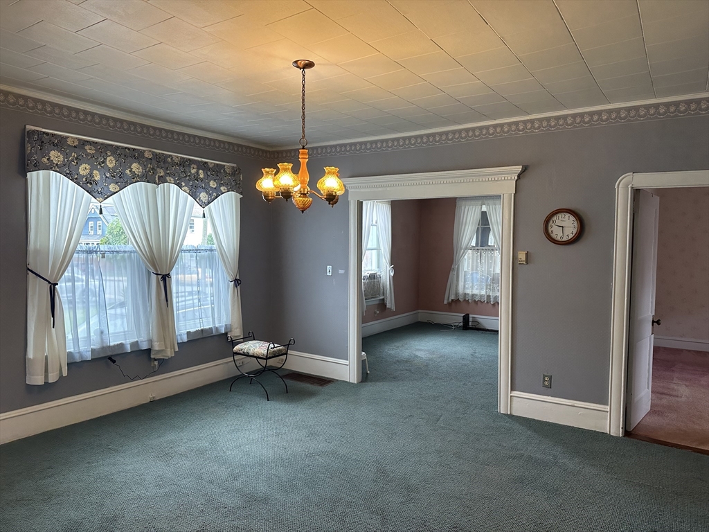 138 Anthony Street Fall River, MA 02721 - Photo 4 of 11 a view of a room with window and chandelier