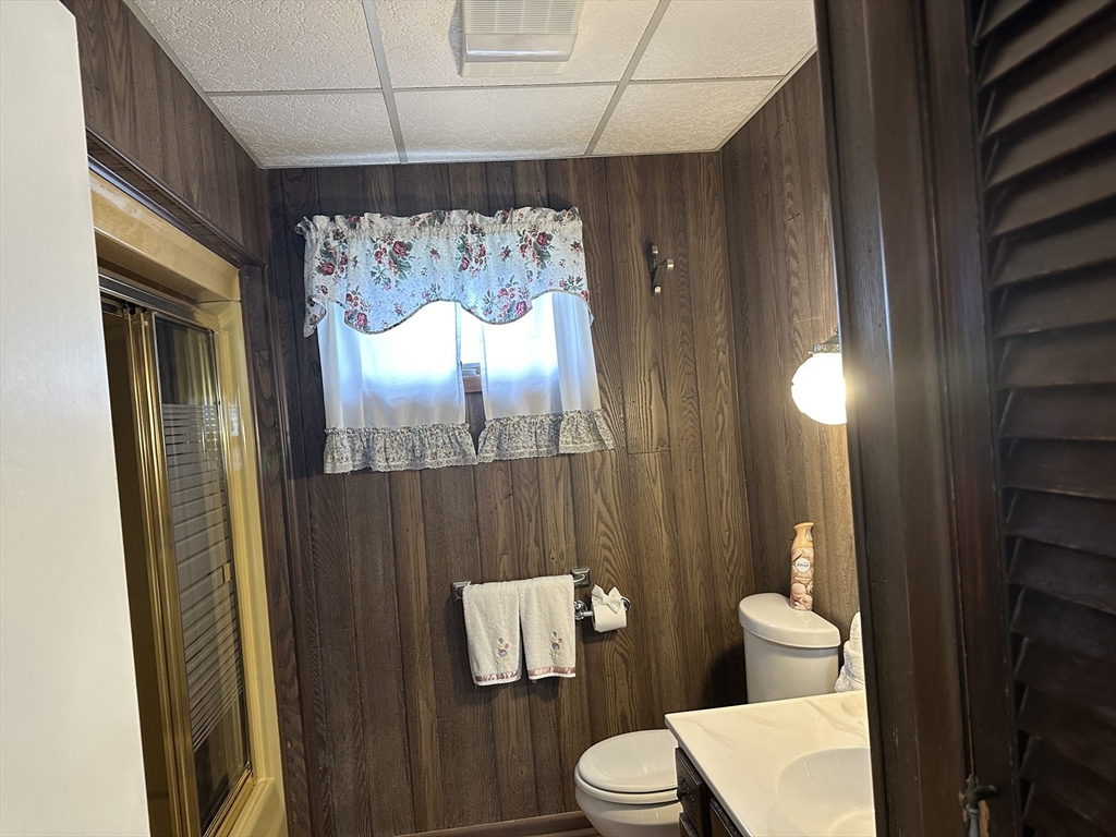 138 Anthony Street Fall River, MA 02721 - Photo 8 of 11 a bathroom with a toilet sink and shower curtain