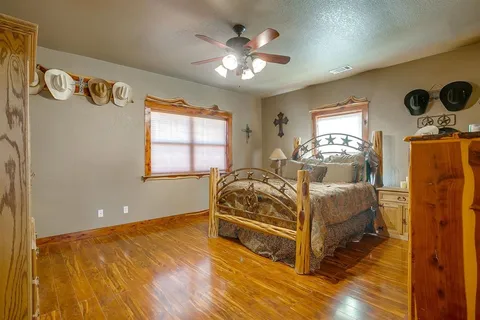 a spacious bedroom with a bed and window