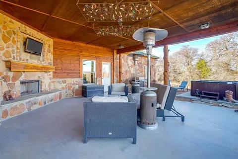 a dining room with furniture and a floor to ceiling window