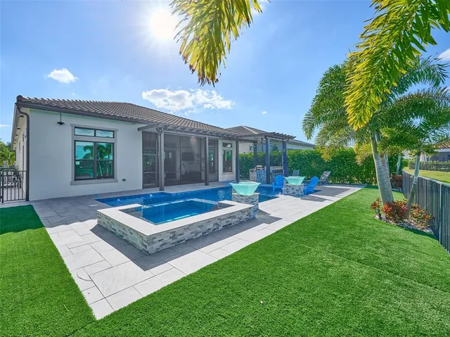 a view of empty room with window and wooden floor