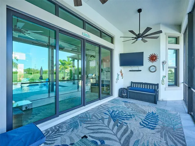 a kitchen with kitchen island granite countertop a sink cabinets and wooden floor