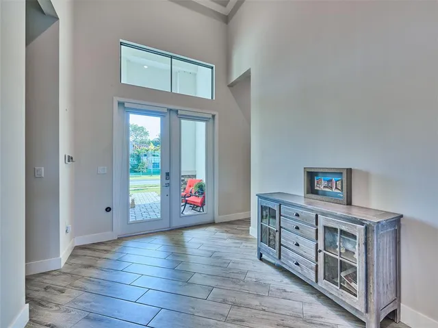 a kitchen with a sink cabinets and wooden floor