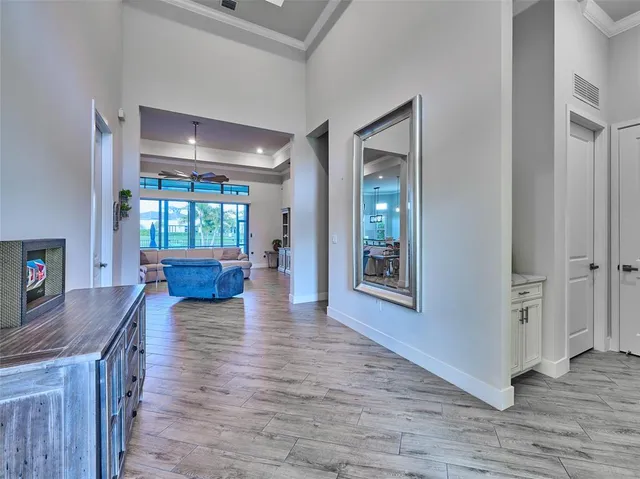 a kitchen with a sink cabinets and wooden floor