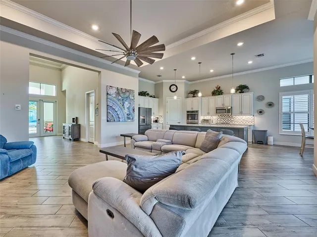 a bathroom with a granite countertop toilet sink and mirror