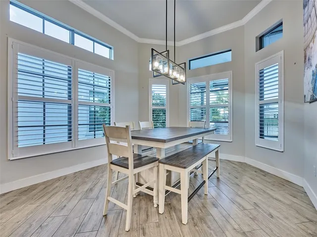 a spacious bedroom with a bed and a flat screen tv