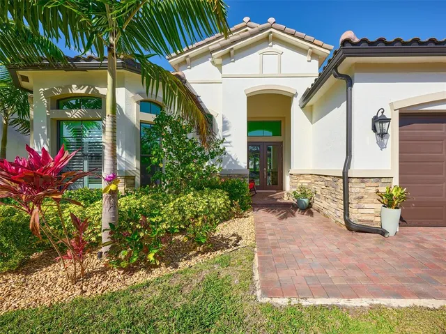 a view of an entrance to house with yard