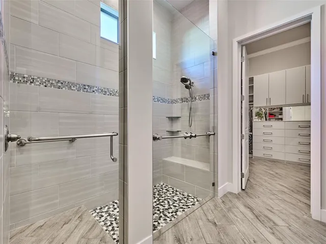 a utility room with cabinets washer and dryer