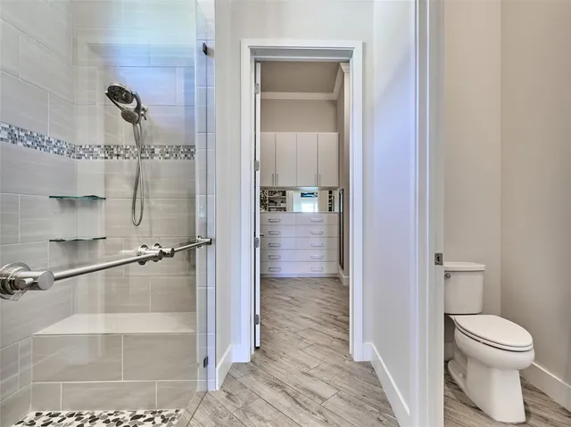 a view of swimming pool with seating space and yard in the back