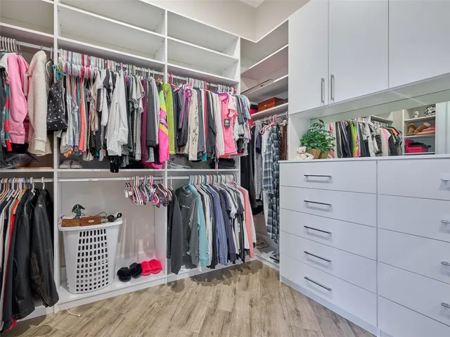 an aerial view of a house with a garden and lake view