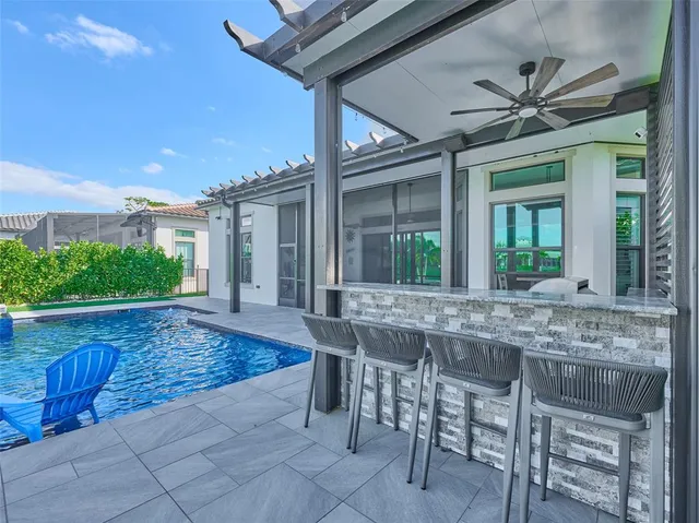 a bedroom with a bed and a flat tv screen