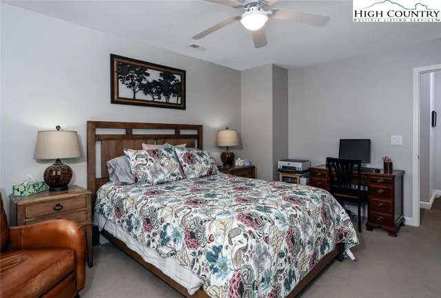 a view of room with window and wooden floor