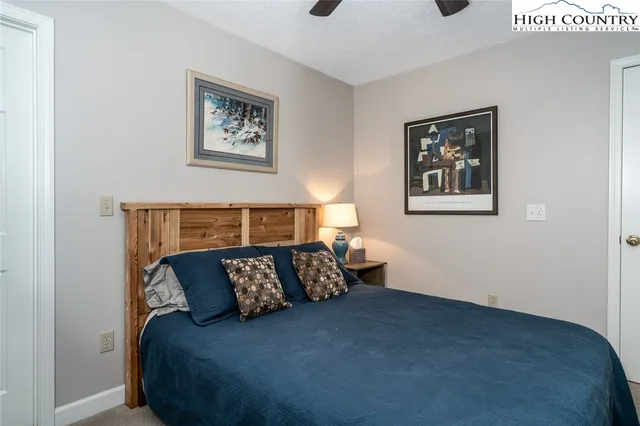 a bathroom with a sink mirror vanity and toilet