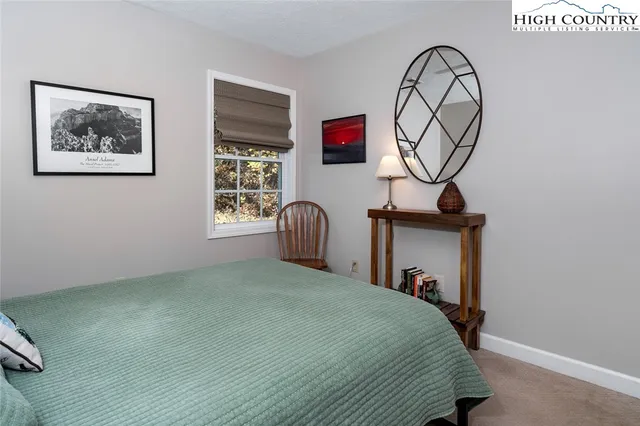 a view of a patio with table and chairs and potted plants