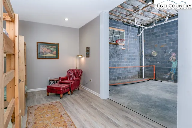 a view of a house with a yard and large trees