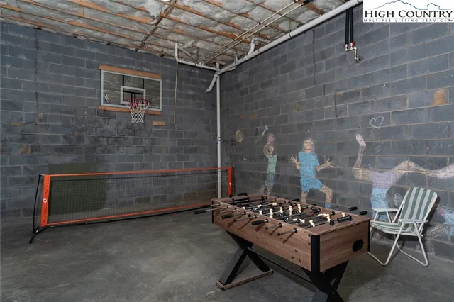 a aerial view of a house with yard and lake view