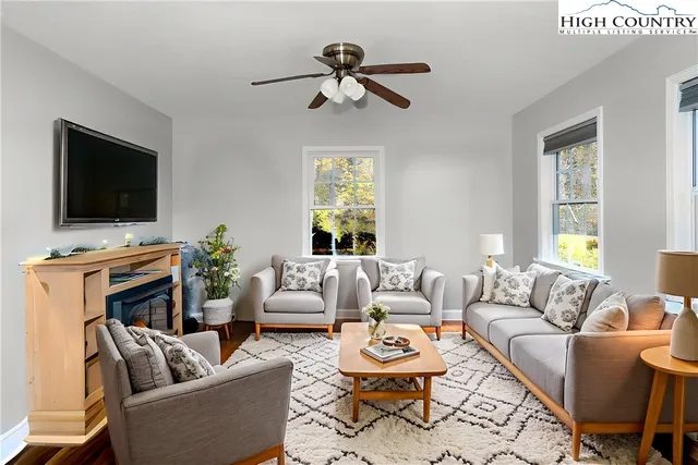 a bedroom with a bed window and a dresser