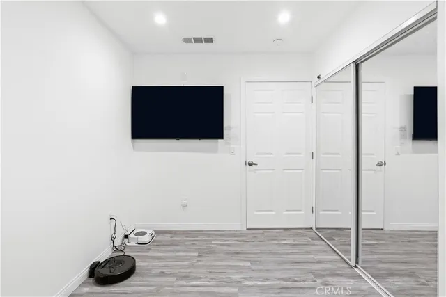 a view of a livingroom with wooden floor