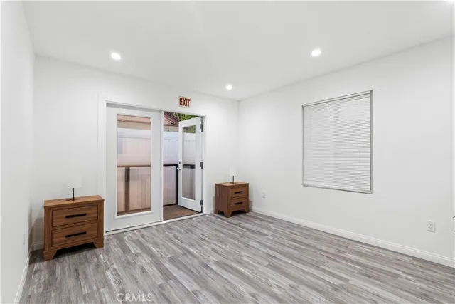 a view of room with wooden floor