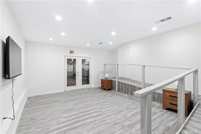 a view of entryway with wooden floor