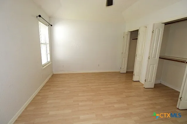 a view of an empty room and window
