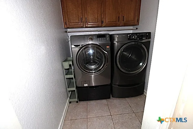 a view of a chairs and table in backyard
