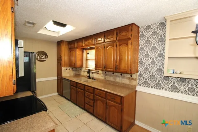 a bathroom with a double vanity sink and mirror