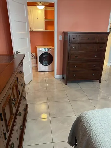 a view of a closet with wooden floor