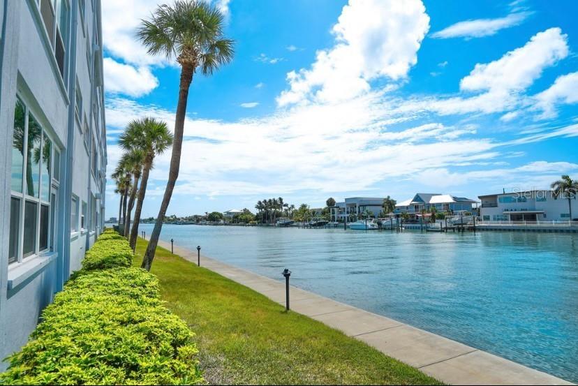 5555 Gulf Boulevard, Unit 104 St. Pete Beach, FL 33706 - Photo 23 of 35 a view of a lake with a garden
