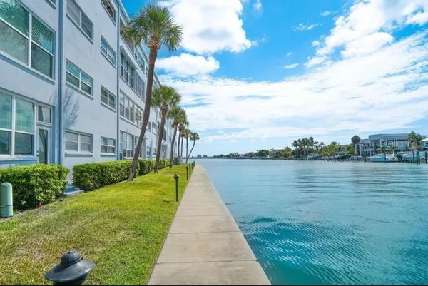 a view of a swimming pool and a yard