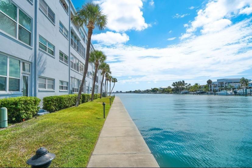 5555 Gulf Boulevard, Unit 104 St. Pete Beach, FL 33706 - Photo 24 of 35 a view of a lake with a yard