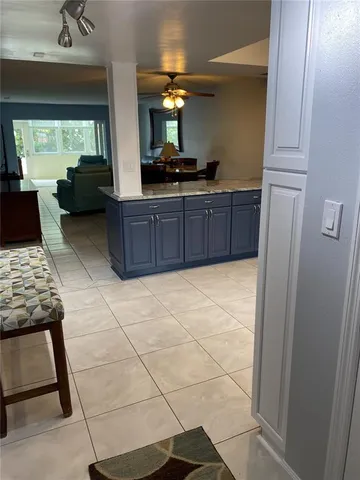 a kitchen with stainless steel appliances a refrigerator and cabinets