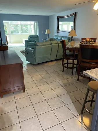 a kitchen with stainless steel appliances a stove a sink and a cabinets
