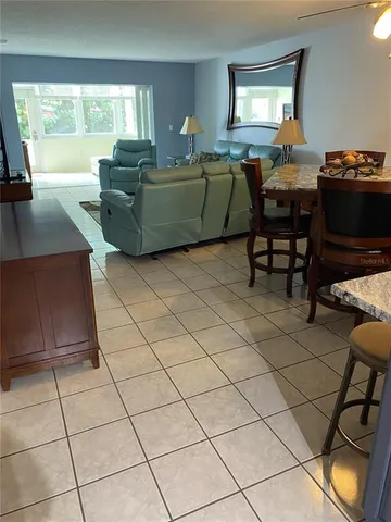a kitchen with stainless steel appliances a stove a sink and a cabinets