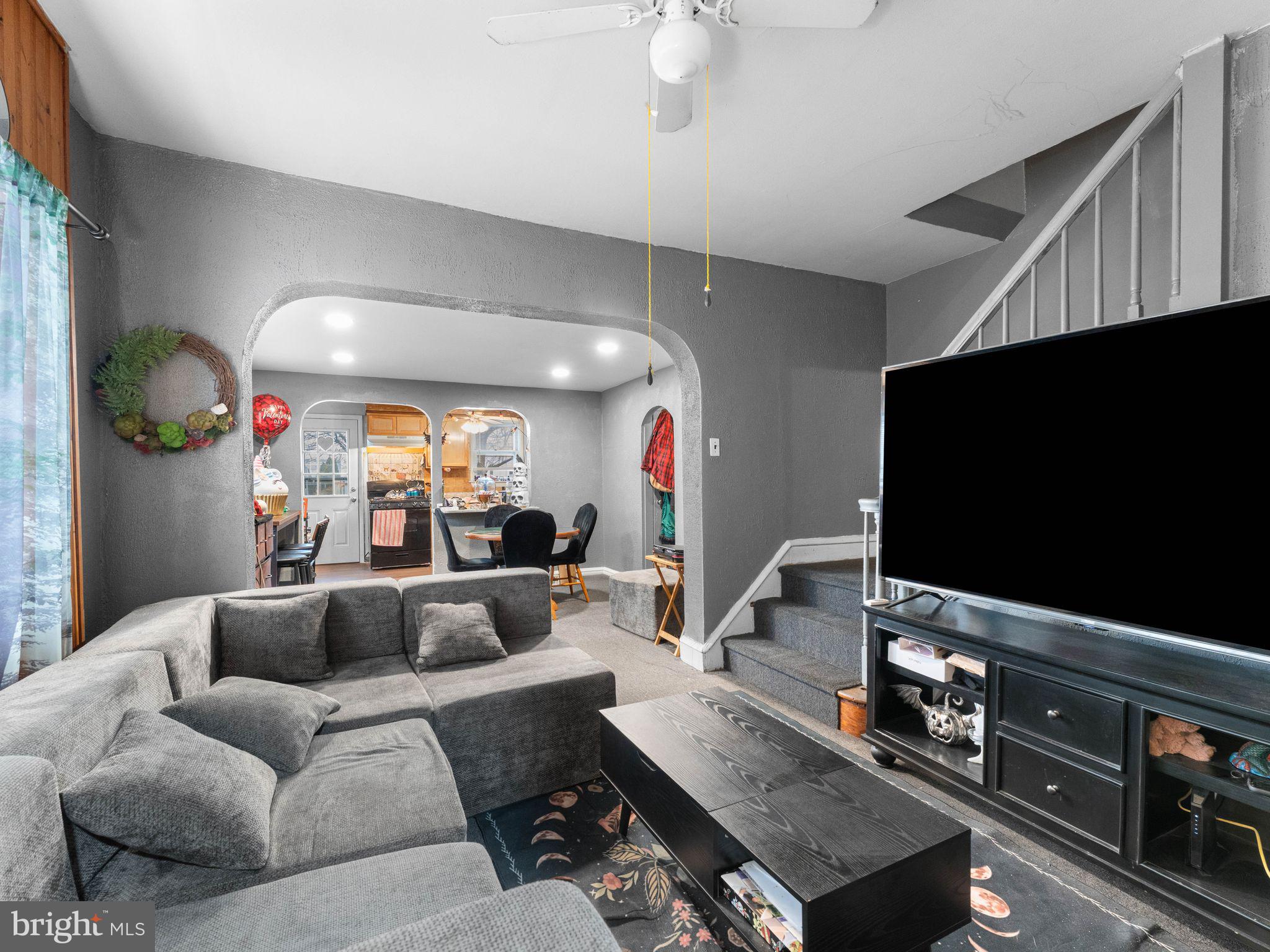 400 Market Street Marcus Hook, PA 19061 - Photo 12 of 25 a living room with furniture and a flat screen tv