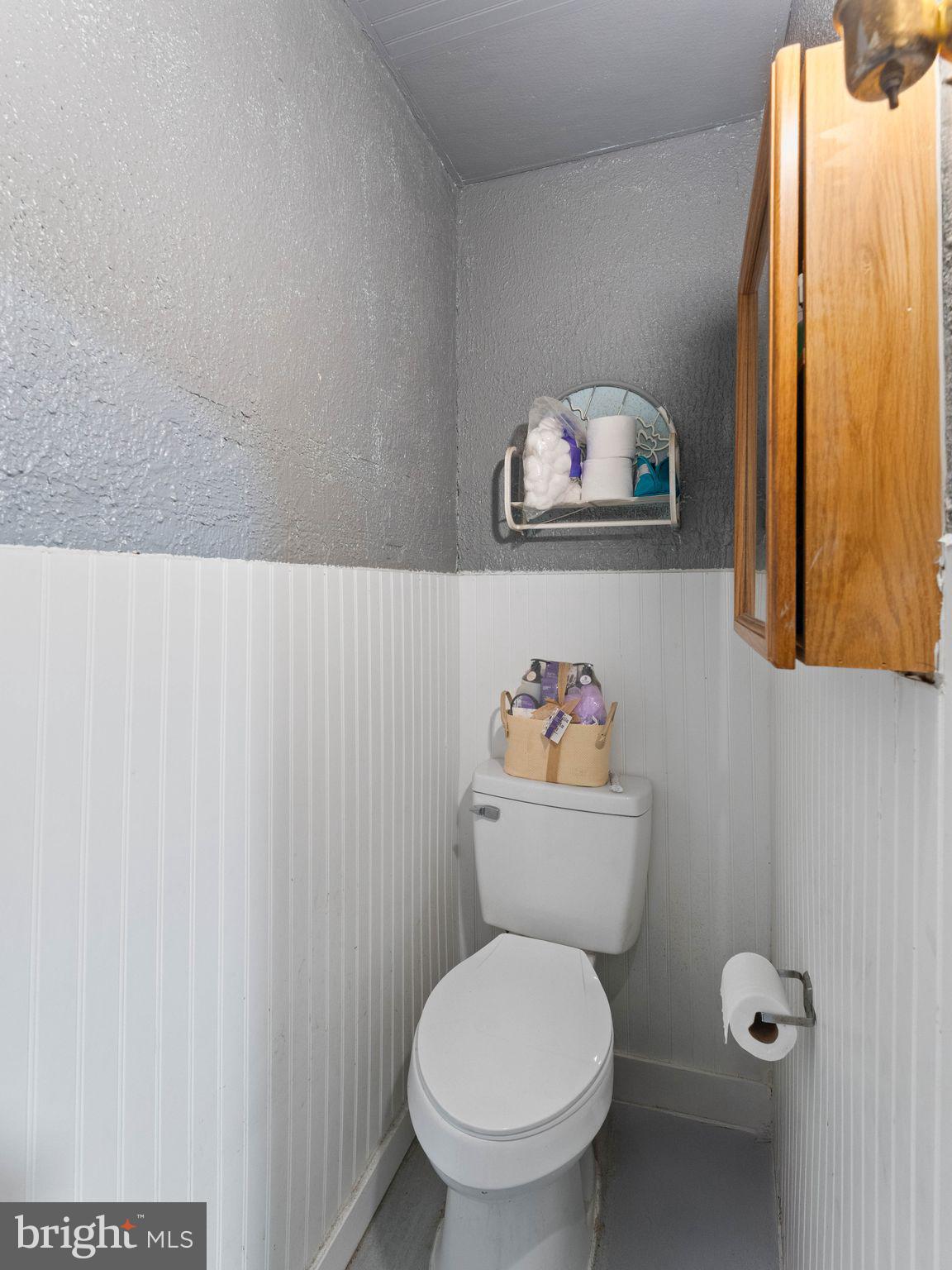 400 Market Street Marcus Hook, PA 19061 - Photo 15 of 25 a white toilet sitting next to a bathroom sink