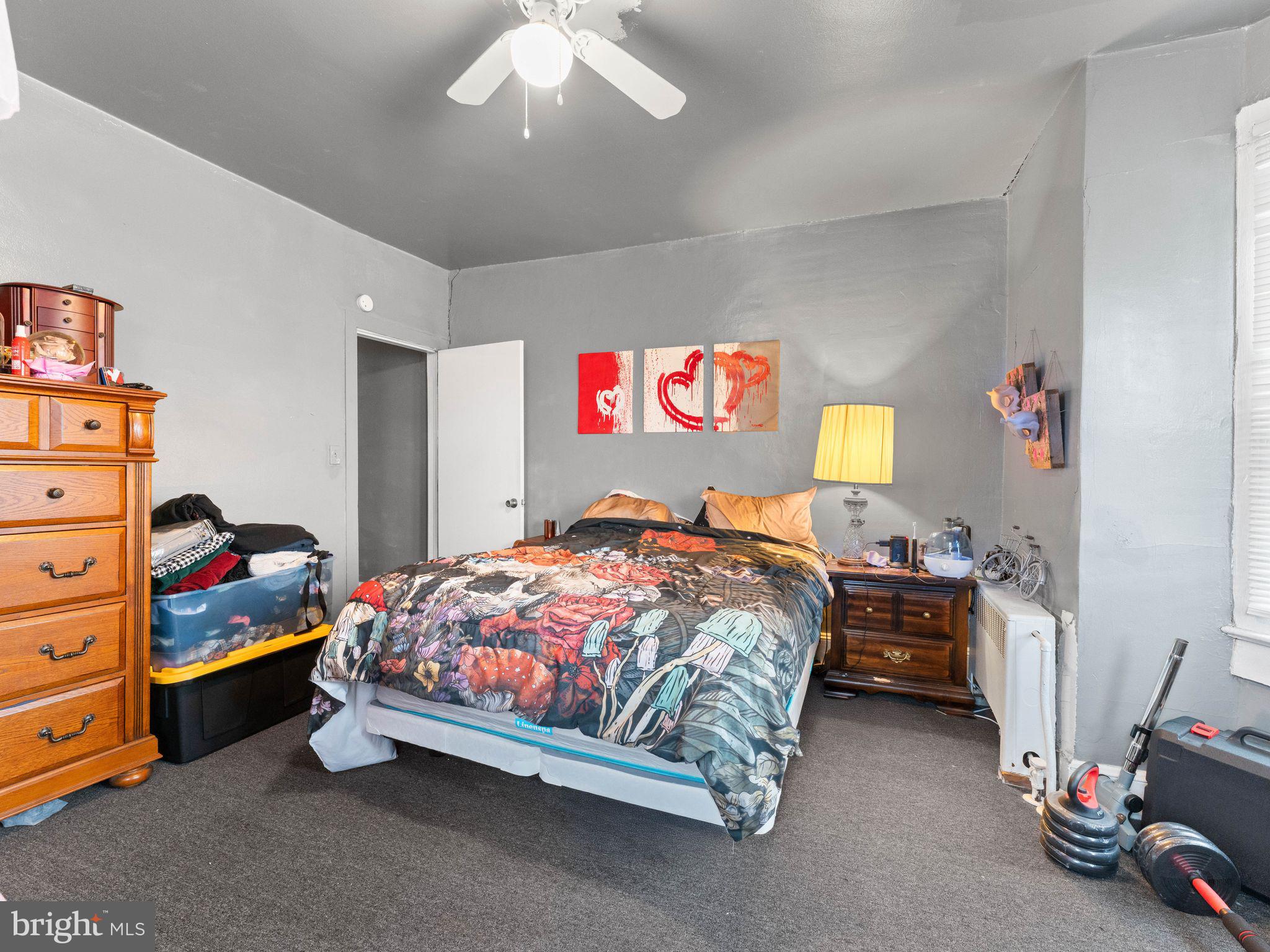 400 Market Street Marcus Hook, PA 19061 - Photo 16 of 25 a bedroom with a bed and a dresser in it
