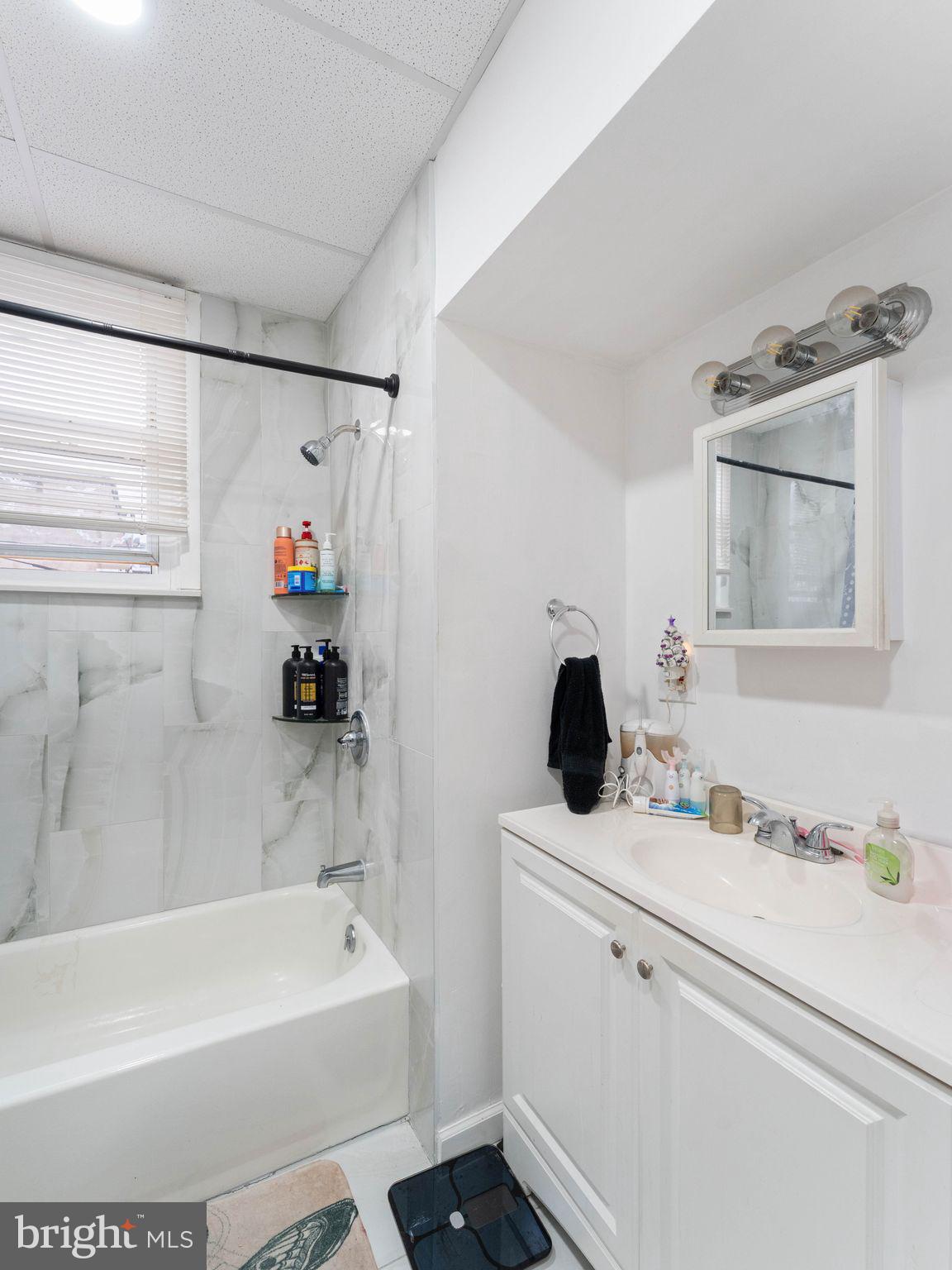 400 Market Street Marcus Hook, PA 19061 - Photo 22 of 25 a bathroom with a bathtub sink vanity and mirror