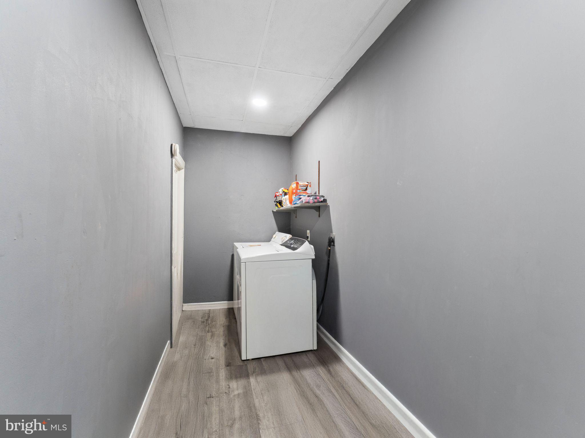400 Market Street Marcus Hook, PA 19061 - Photo 23 of 25 a room with a wooden floor and washer