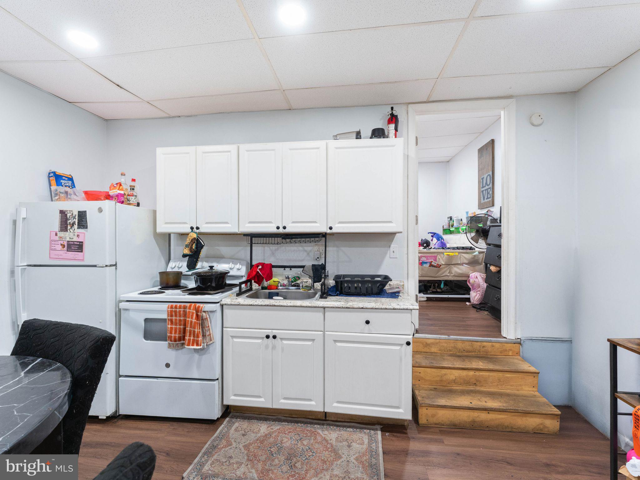 400 Market Street Marcus Hook, PA 19061 - Photo 5 of 25 a kitchen with white cabinets and white appliances