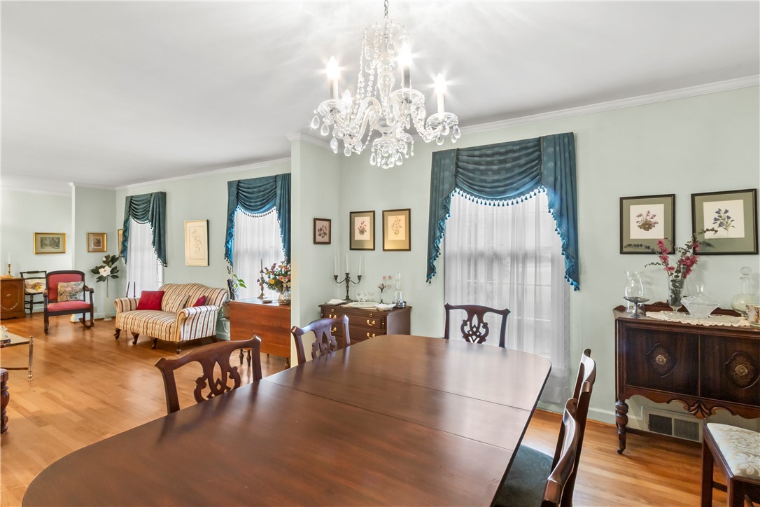 118 Blair Road Belton, SC 29627 - Photo 11 of 49 Hardwood floors and detailed crown moldings enhance this traditional dining space.