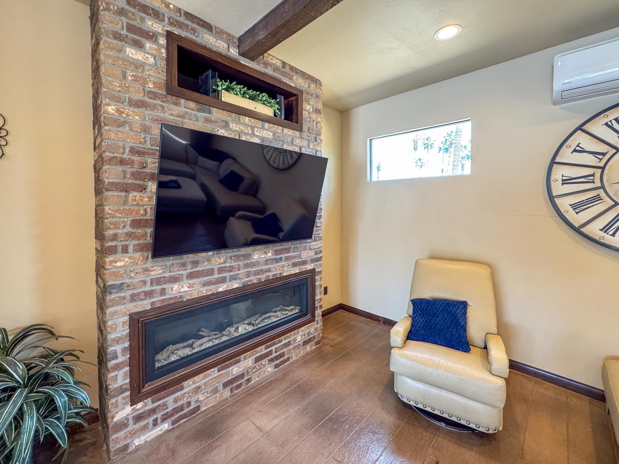 80394 Ave 48, Unit 116 Indio, CA 92201 - Photo 13 of 26 a living room with furniture and a fireplace