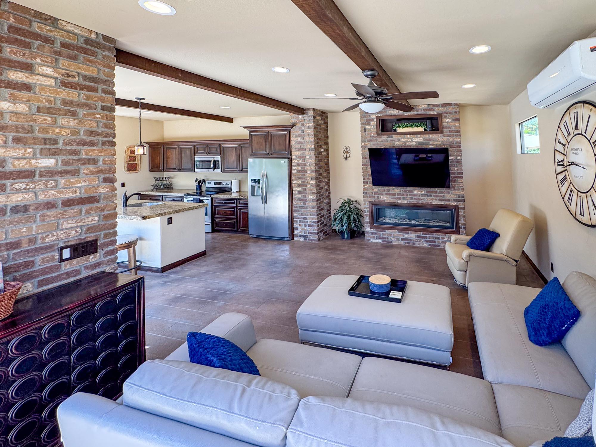 80394 Ave 48, Unit 116 Indio, CA 92201 - Photo 23 of 26 a living room with furniture and a flat screen tv
